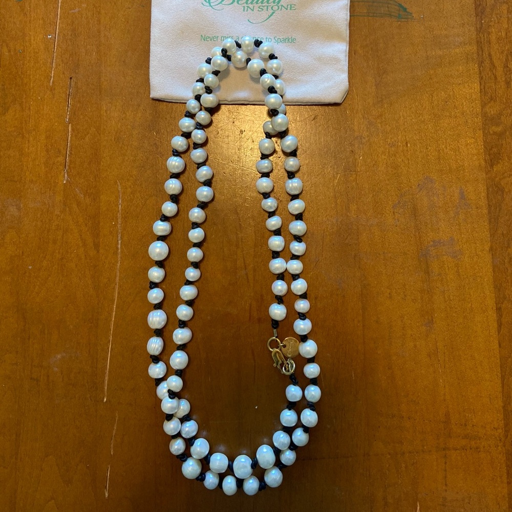 Beauty in Stone.  Long strand of pearls.